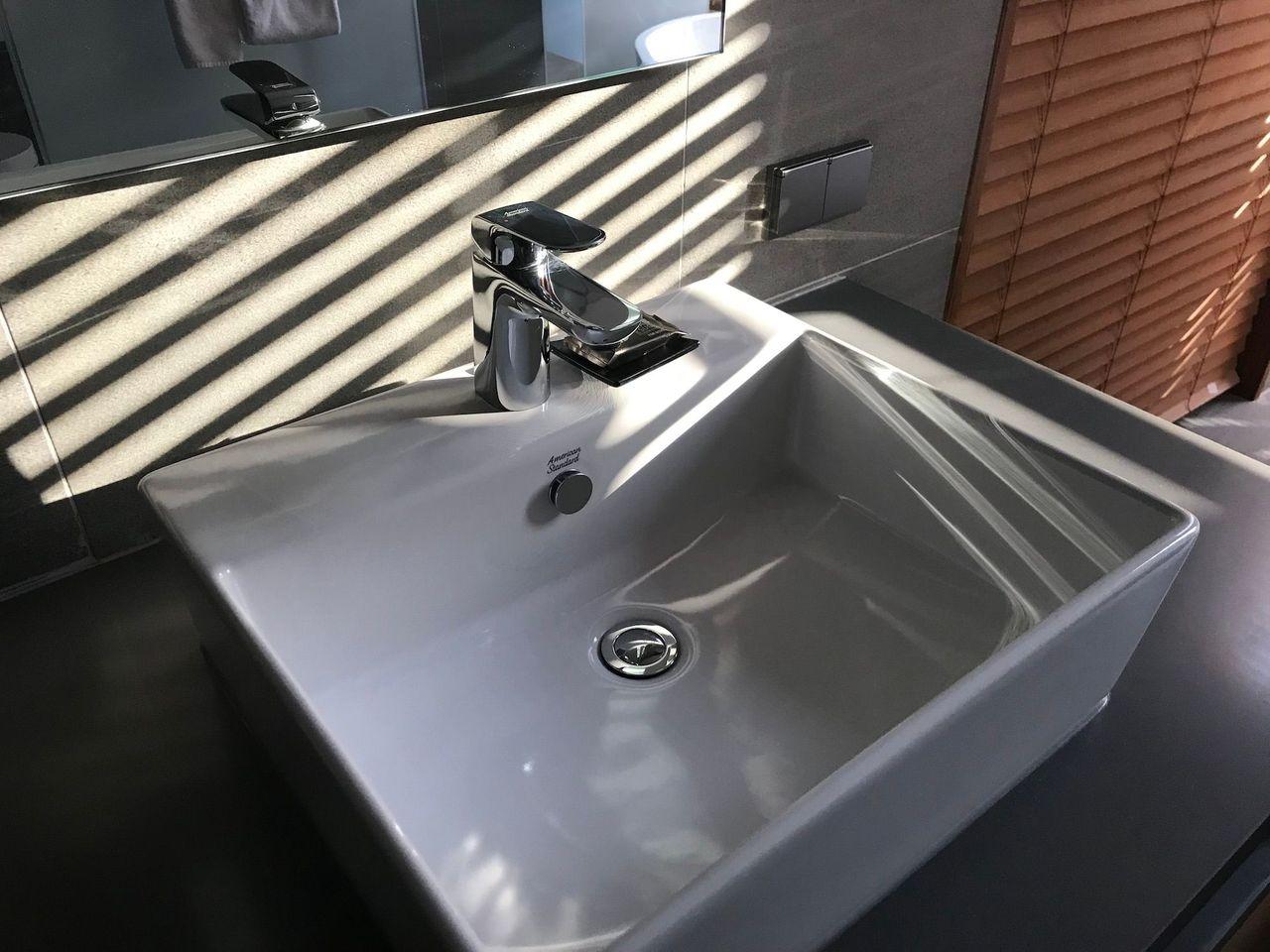 Sleek silver bathroom faucet with ambient lighting at Dongdaemun Novotel Ambassador Hotel.